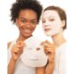 2 girls displaying garnier moisture bomb night face mask